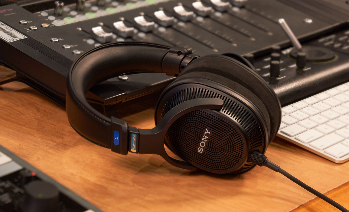  Image of the Sony MDR-MV1 Open Back Studio Monitor Headphones sitting on a desk with recording equipment