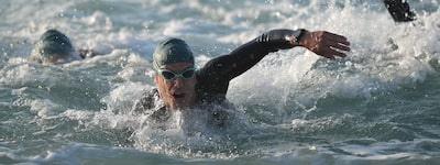 Example image of several triathletes swimming