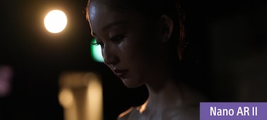 Example image showing a ballerina backstage in dim lighting