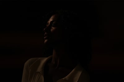 Portrait photo of a woman in a dark moonlit scene