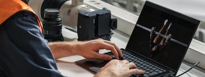 Image of a man using a laptop