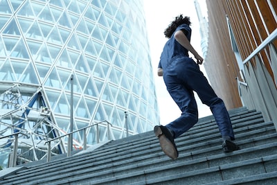 Example image of a man running up the stairs